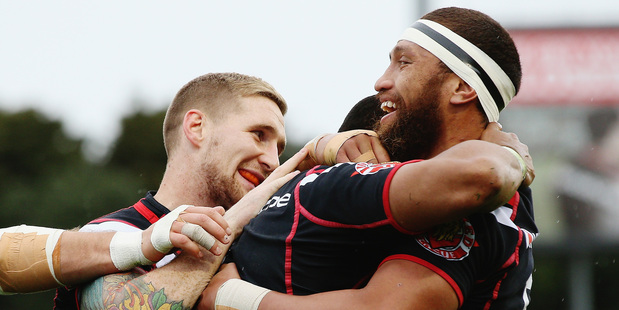 Dominique Peyroux of the Warriors celebrates with Sam Tomkins and Manu Vatuvei after scoring a try during the NRL match between the Warriors and the Titans. Photo / Getty Images