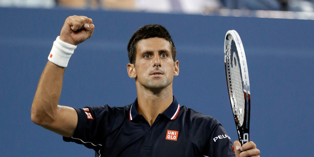 Novak Djokovic, of Serbia, reacts after winning a game against Andy Murray, of Britain, during the quarterfinals of the U.S. Open tennis tournament. Photo / AP