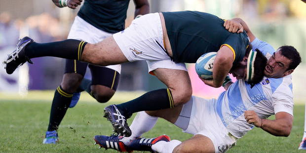Argentina's Agustin Creevy, right, tackles South Africa's Frans Malherbe during their Rugby Championship match in Salta, Argentina. Photo / Getty Images