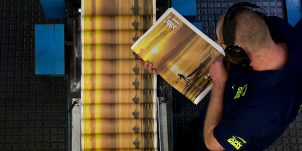 The first edition of the new compact New Zealand Herald rolling off the press at APN Print in Ellerslie. Photo / APN