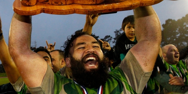 Pirates prop Herman Retzlaff hoists the Fox shield. Photo / Jason Oxenham