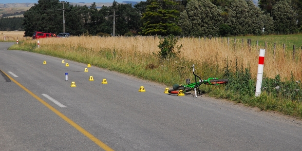 CRASH SCENE: Police are investigating after a bike-car collision in Park Rd, Carterton, yesterday. PHOTO/KELLI HOOKS