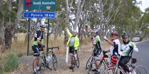 Wayne Henderson (left) and the group at the Victoria-South Australia border; and a drinks' break is greatly enjoyed en route to Adelaide.