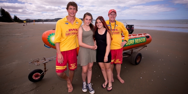 Lifeguards James Campbell (left) and Nick Tomkins helped to save Casey Trumper (second left), Ashleigh Neal and two would-be rescuers at Orewa Beach. Photo / Dean Purcell