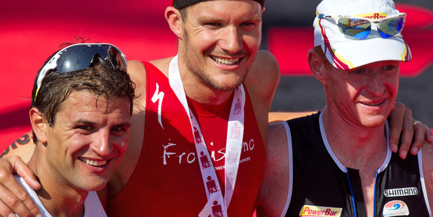Terenzo Bozzone, Jan Frodeno of Germany and Richie Cunningham from Australia, celebrate their placings in the Ironman 70.3. Photo / Richard Robinson