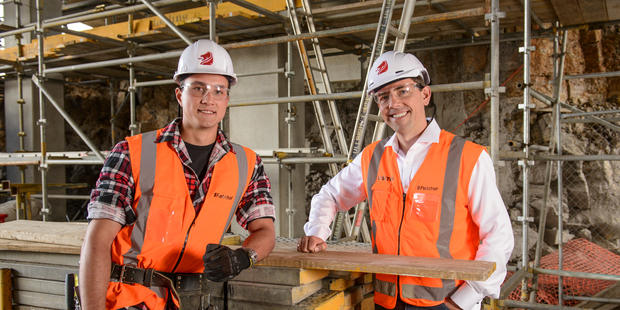 Fletcher building CEO Mark Adamson (right) with Christchurch-based apprentice Luke Thomas. Photo / Ted Baghurst
