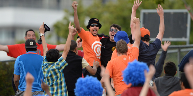 Fans celebrates a one handed catch and a chance to win one hundred thousand dollars at match 2 of the ANZ One Day International Cricket Series. Photo / Photosport.