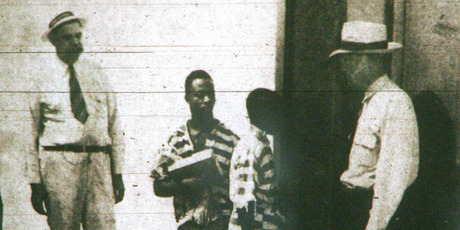 George Stinney, Jr., 14, center right, and Bruce Hamilton, 21, center left, as they enter the death house in the state prison in Columbia. Photo / AP