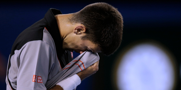 Novak Djokovic of Serbia reacts to a lost point against Stanislas Wawrinka of Switzerland during their quarterfinal at the Australian Open. Photo / AP