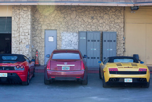 A Lamborghini, right, allegedly involved in a drag race is shown in an impound lot in Miami Beach, Florida. Photo / AP