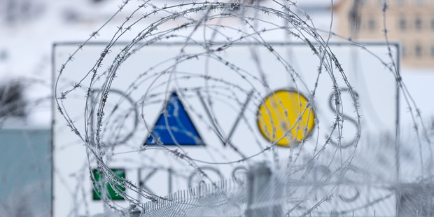 A fence outside the site of the World Economic Forum in Davos Switzerland. NZ finance minister Bill English hopes the issue of taxing the world's big tech companies will be addressed. Photo / AP
