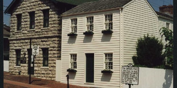 The original museum is next door to Mark Twain's white-painted boyhood home.