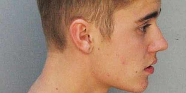 Justin Bieber poses for a mugshot in the Miami Dade County Corrections Department. Photo/AP