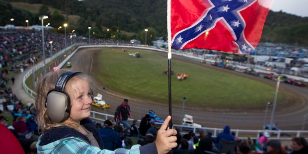 Melissa Curran, 4, flies the flag for her brother Ryan and the Rotorua Rebels at Paradise Valley Raceway on Saturday. Photo/Stephen Parker