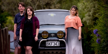 Graham Hughes, Maryana Hamilton and Stacey Dowler, who car-pool together and use the T3 lane on Onewa Rd. Photo / Dean Purcell