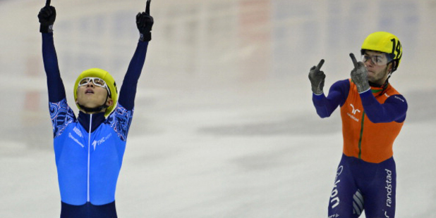 Sjinkie Knegt, right, reacts after losing to Russia's Viktor Ahn in the short track team relay event at the European Championships. Photo / AFP