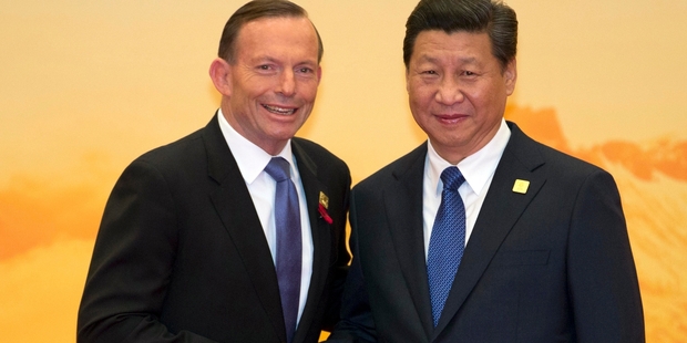Tony Abbott (left) and Xi Jinping. Picture / AP