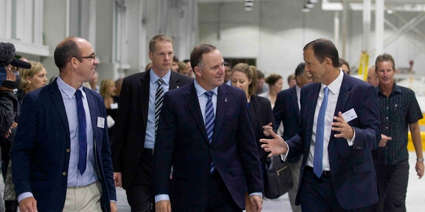 SCA Hygiene president Peter Diplaris (right) and operations manager Mark Kennedy (left) with John Key at the reopening. Photo / Christine Cornege