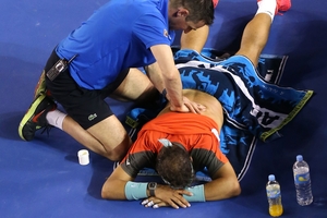 Rafael Nadal receives attention during the Australian Open final. Photo / Getty Images