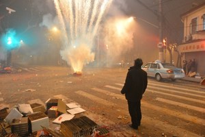 Fireworks explode in a street of Shanghai on the eve of Chinese New Year. Photo / AFP