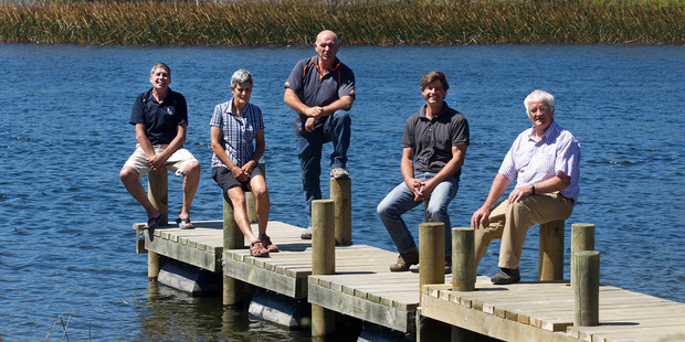 Mac Pacey, Barbara Allen, Chris Sutton, Marcel Schweizer and Bob Parker are keen to keep Lake Rerewhakaaitu clean. Photo / Alan Gibson