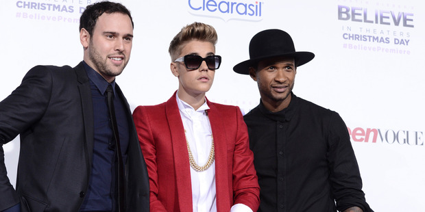 Producer Scooter Braun (left), Justin Bieber and Usher. Photo / AP