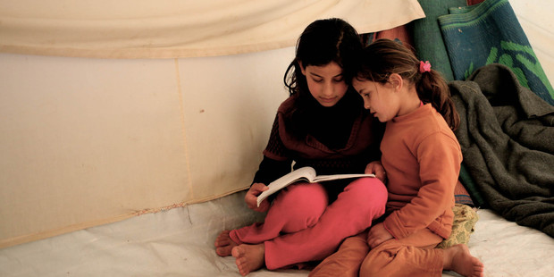 Fatima and Sara Teeme fled their home in Homs. Now more women and children are to be allowed to leave the besiged city. Photo / AP