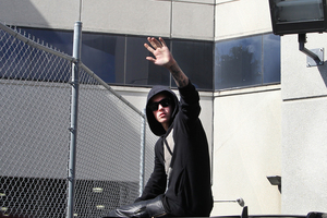 Singer Justin Bieber waved from atop an SUV as he left the Turner Guilford Knight Correctional Centre. He's now had nearly all charges against him dropped. Photo / AP