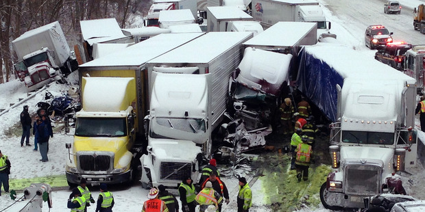The massive pileup involved more than 40 vehicles, many of them semitrailers. Photo / AP