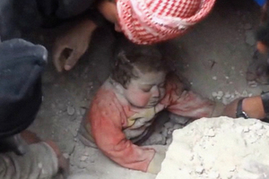 14-month-old Ghina Khalil is rescued from the rubble. Photo / AP