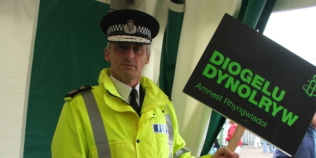 Richard Brunstrom in 2006 (with a sign in Welsh proclaiming "Protect mankind'').