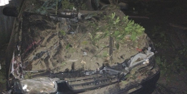 The Ford left the road and ploughed across one property before smashing into a neighbouring carport.