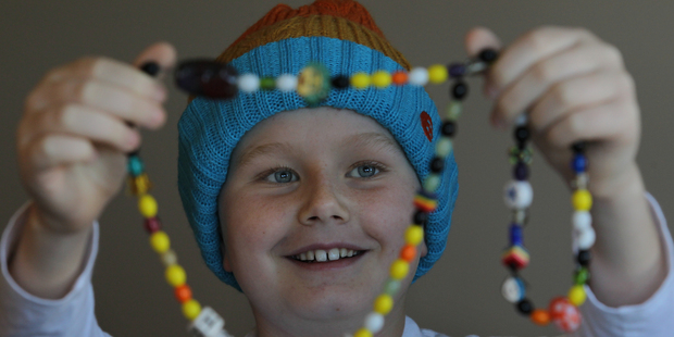 Papamoa 10-year-old Harrison Mundy pictured with his Beads of Courage is one of the children living with cancer who will benefit from the Child Cancer Foundation annual appeal.