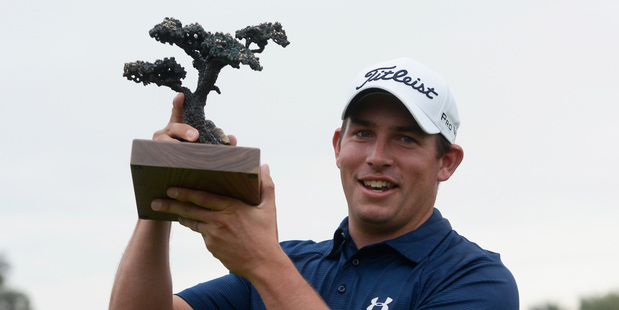 Scott Stallings stands with his trophy after winning the Farmers Insurance Open. Photo / Getty Images