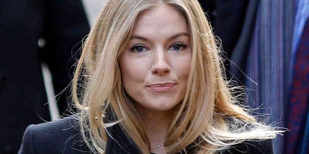 After hacking Daniel Craig's phone, the News of the World said he was having an affair with Sienna Miller. Photo / AP
