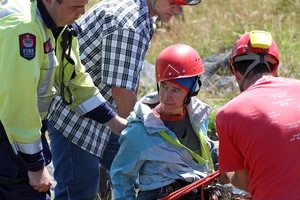 Rescuers help pull Jill Clendon from the sinkhole on Takaka Hill, near the Ngarua Caves. Photo / Tim Cuff