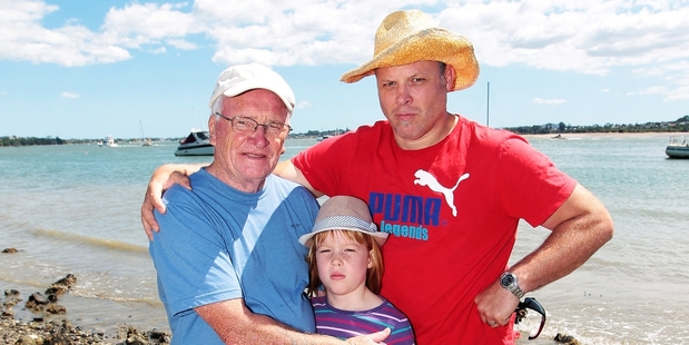 Alistair Kennedy (left), granddaughter Molly and her father, Simon Butler, after yesterday's close call at Bucklands Beach. Photo / Doug Sherring