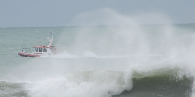 Coastguard Hawke's Bay's rescue craft, the Celia Knowles, takes advantage of high seas to do some manoeuvres off Pacific Beach (Marine Parade), Napier, soon after the abnormally high tide yesterday morning.