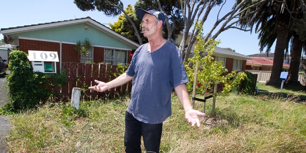 Chris Mills, who lives in a lawn-free Ellerslie property, has had an ongoing dispute with Auckland Transport over mowing the council's berm. Photo / Richard Robinson