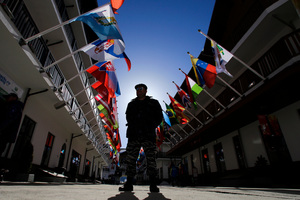 A Russian police officer stands guard at the Mountain Olympic Village prior to the start of the 2014 Winter Olympics. Photo / AP