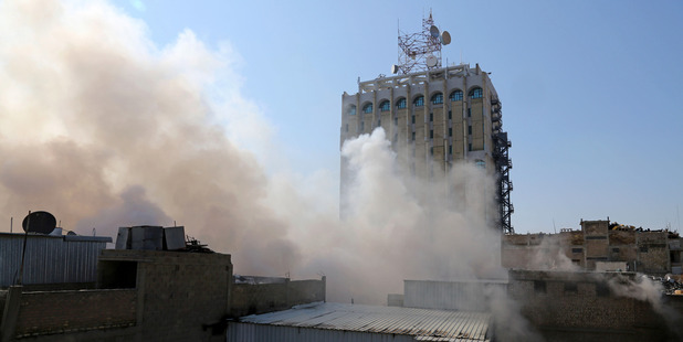 Smoke rises after a car bomb went off at a commercial centre in Khilani Square in central Baghdad, Iraq. Photo / AP