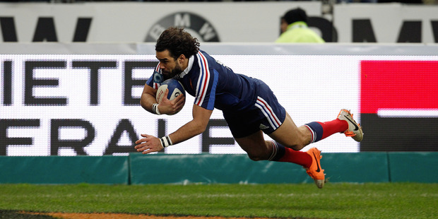 France's Yoann Huget scores a try for France. Photo / AP