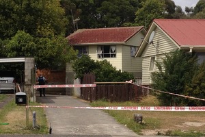 Hamilton police attend the scene of the homicide. Photo / Christine Cornege
