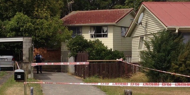 Hamilton police attend the scene of the homicide. Photo / Christine Cornege