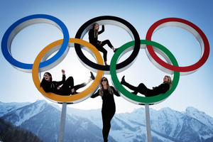 New Zealand snowboarders create a striking tableau in the Olympic rings at Sochi, Russia.