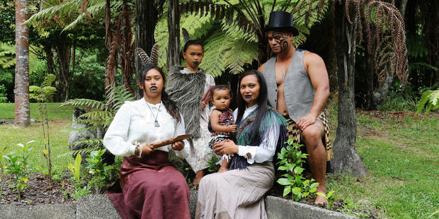 Tekitea and Tuinga Weti with Tumanako Mcleod and Kaida-Miharo, 1, and Ratima Weti have their portrait taken at the Historic Village during Waitangi Day events yesterday. Photo / Ruth Keber