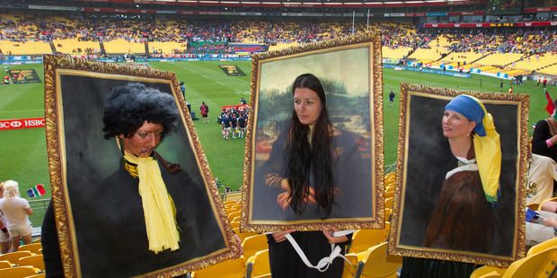 Oil paintings, from left, Stacey Roper, Auckland, Mel McGhie, Whanganui, and Jacqueline Roper, Auckland on day one of 5th round of the HSBC Sevens World Series. Photo / Mark Mitchell.
