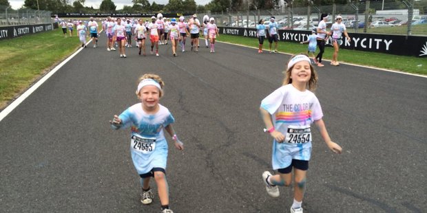 Lachlan Buckley and Maya Keall Flynn at the end of The Color Run.