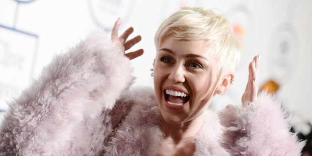 Miley Cyrus strips naked, smokes weed, talks to Ronan Farrow for the cover of 'W'. Photo / AP