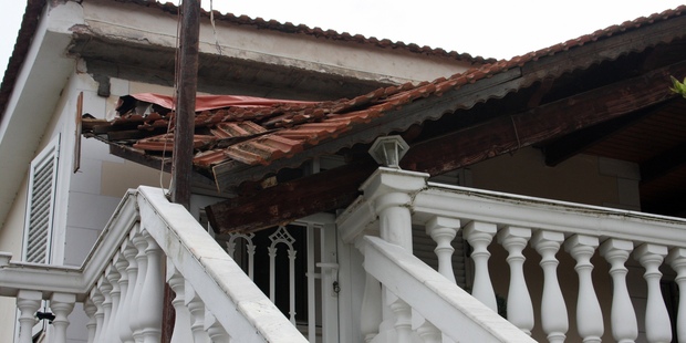 A section of a balcony roof is collapsed after an earthquake in Lixouri town on the island of Kefalonia, western Greece. Photo / AP